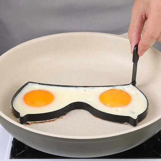 An egg fryer mould in a sexual shape of boobs.