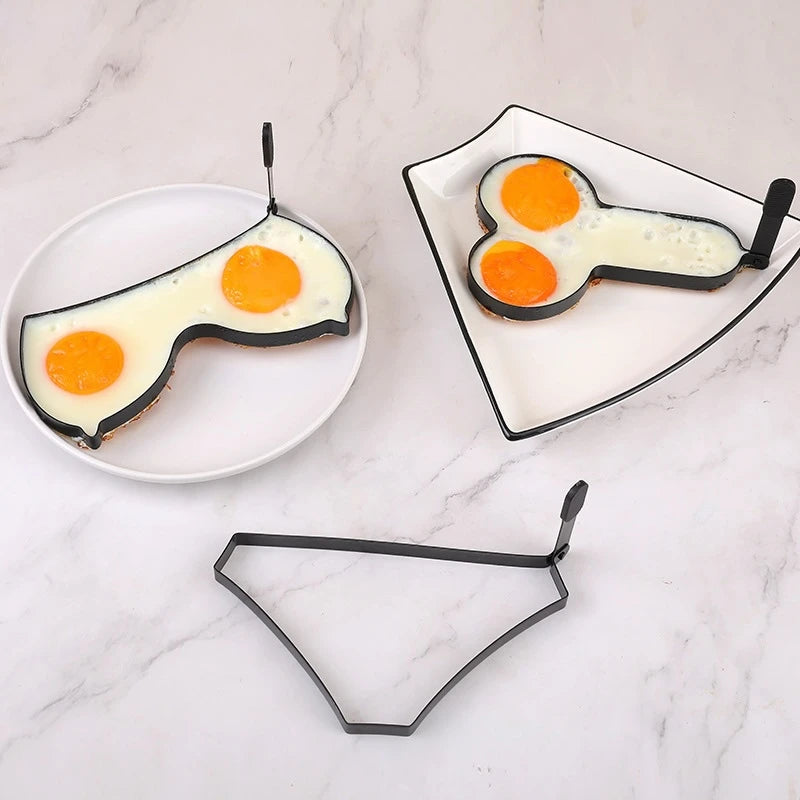 An egg fryer mould in a sexual shape of a boobs, penis and panty.