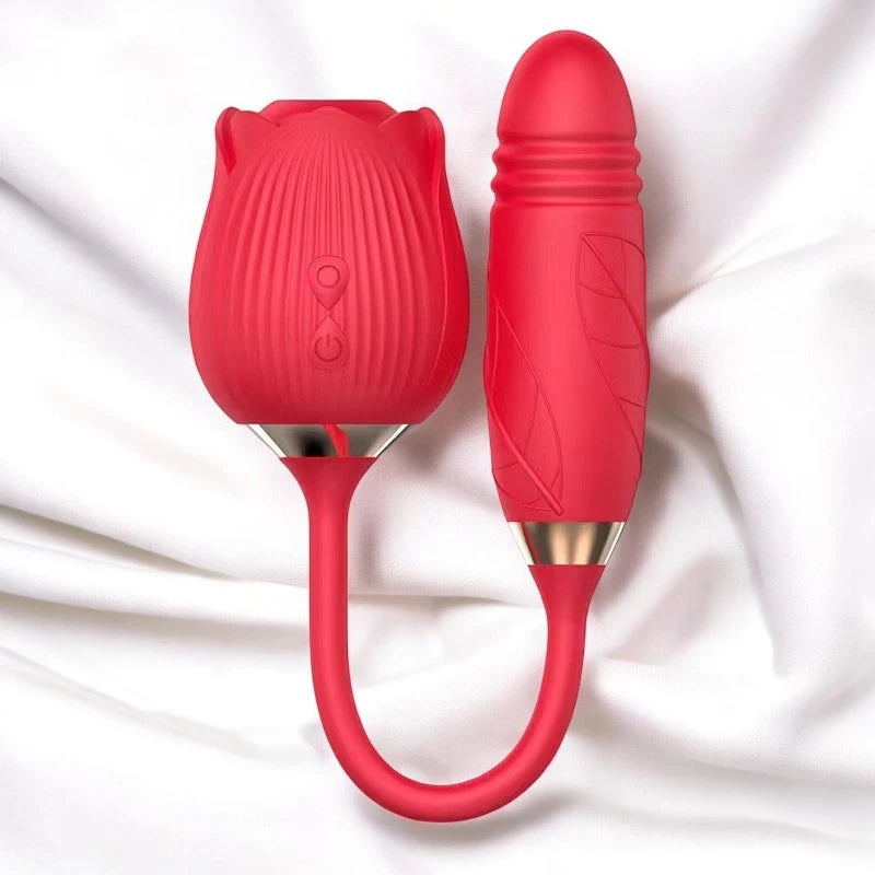 A red rose shaped vibrator with a dual end, one end with a rose head with suction and the other a thrusting wand.
