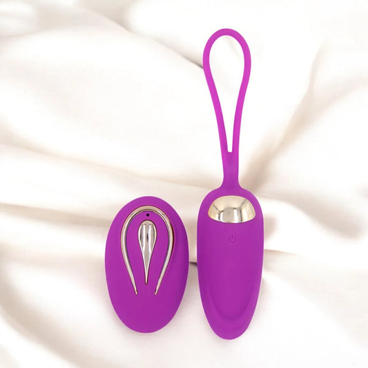 A purple egg shaped vibrator with a remote control.