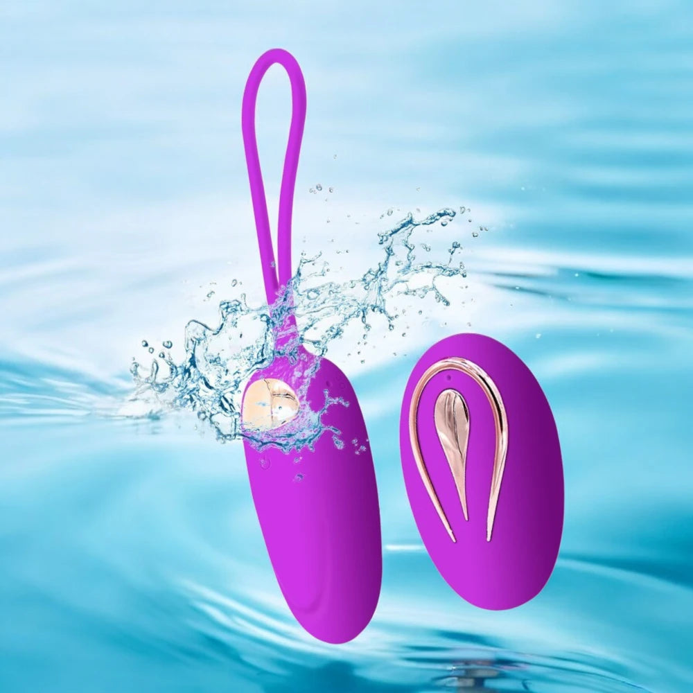 A purple egg shaped vibrator with a remote control.