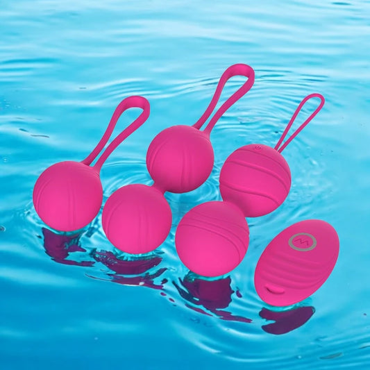 A set of Rose Red Kegel massage balls with loops for easy handling with a wireless remote control.