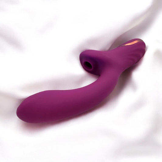 A smooth silky curved design purple dildo with clitoris suction.
