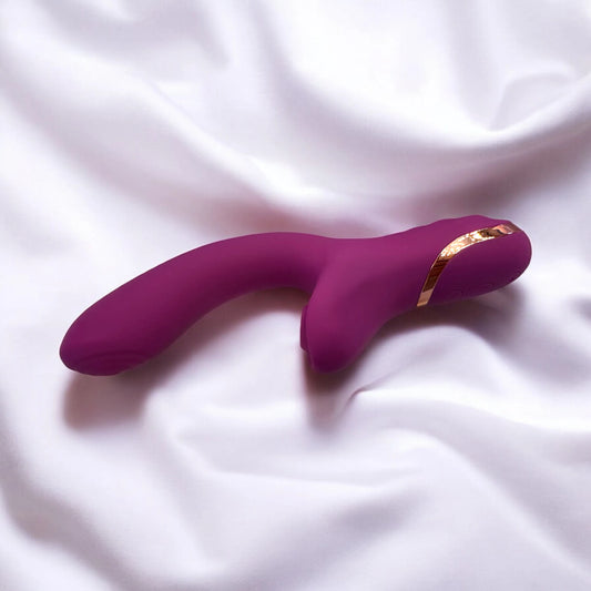 A smooth silky curved design purple dildo with clitoris suction.