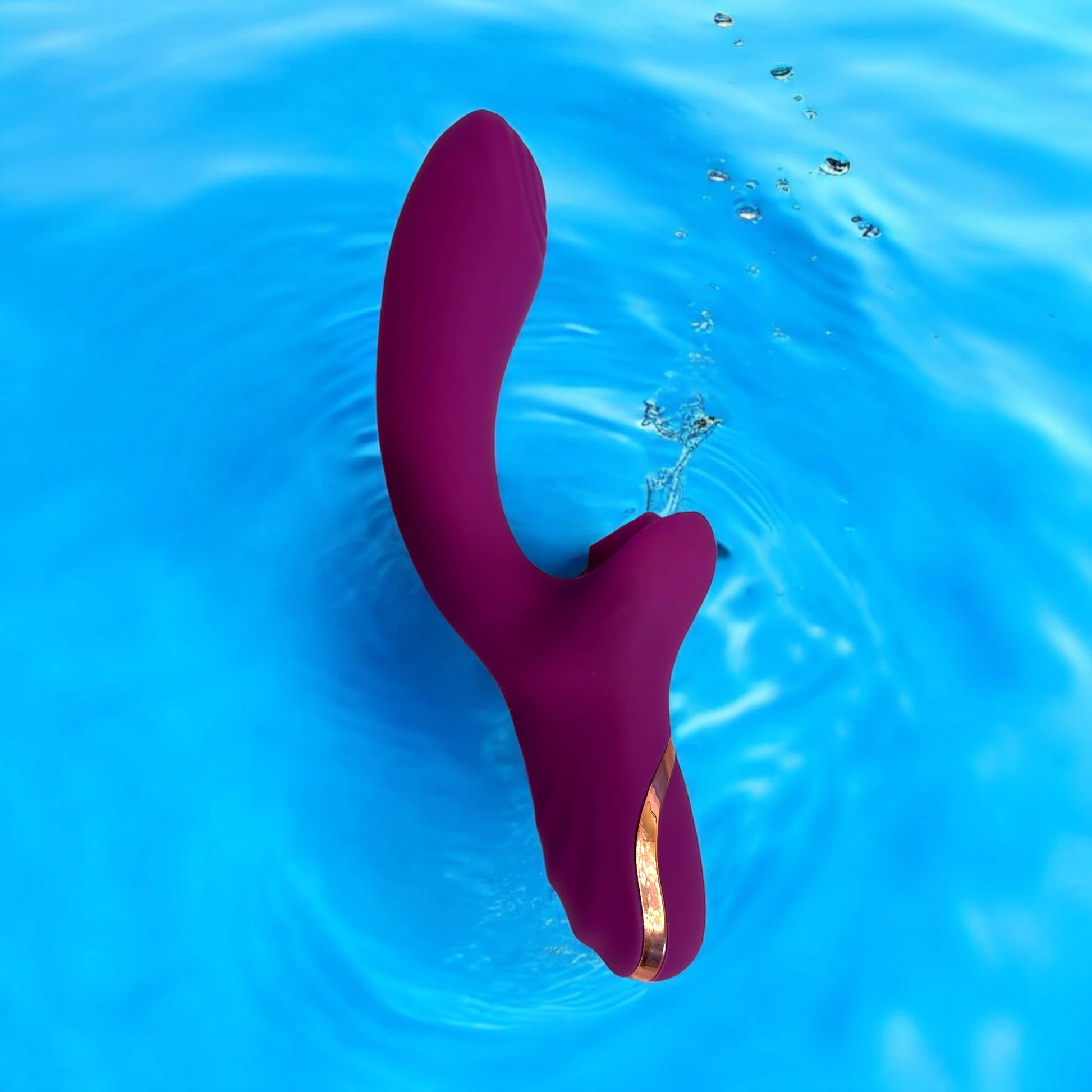 A smooth silky curved design purple dildo with clitoris suction.