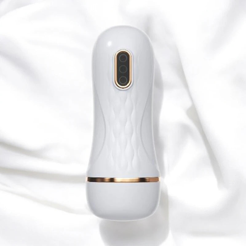 A white handheld rechargeable electric masturbating cup.