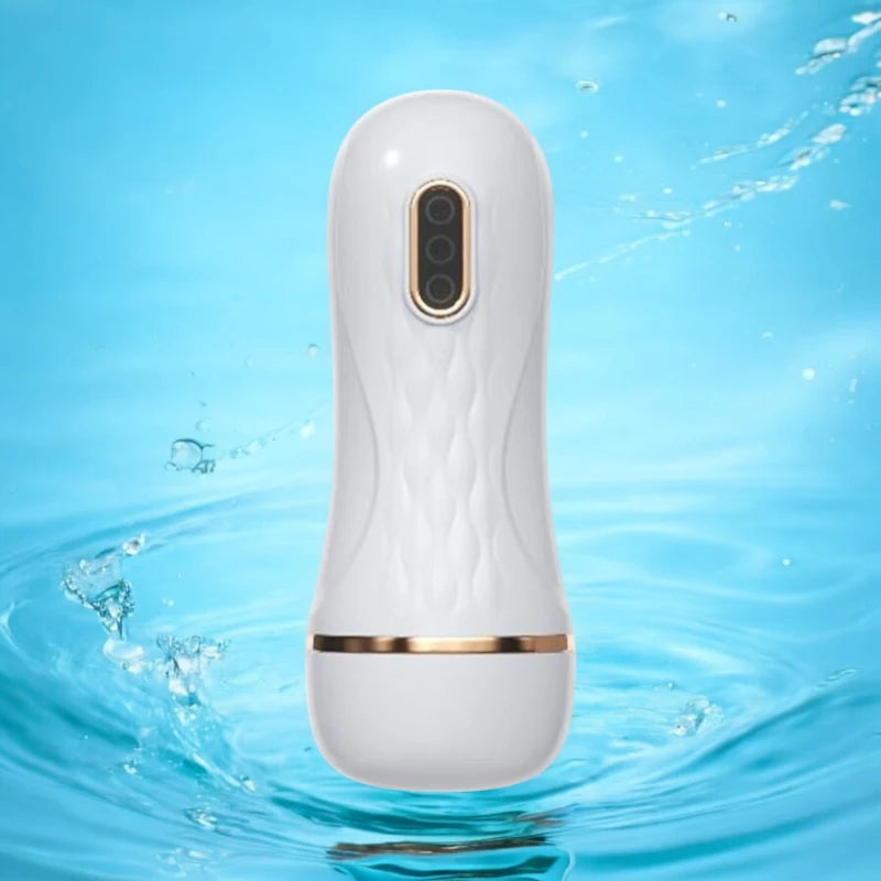 A white handheld rechargeable electric masturbating cup.