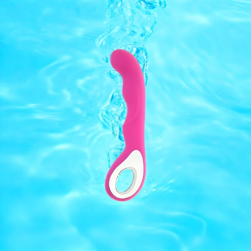 A rose red vibrator with a curved  ergonomic loop handle.