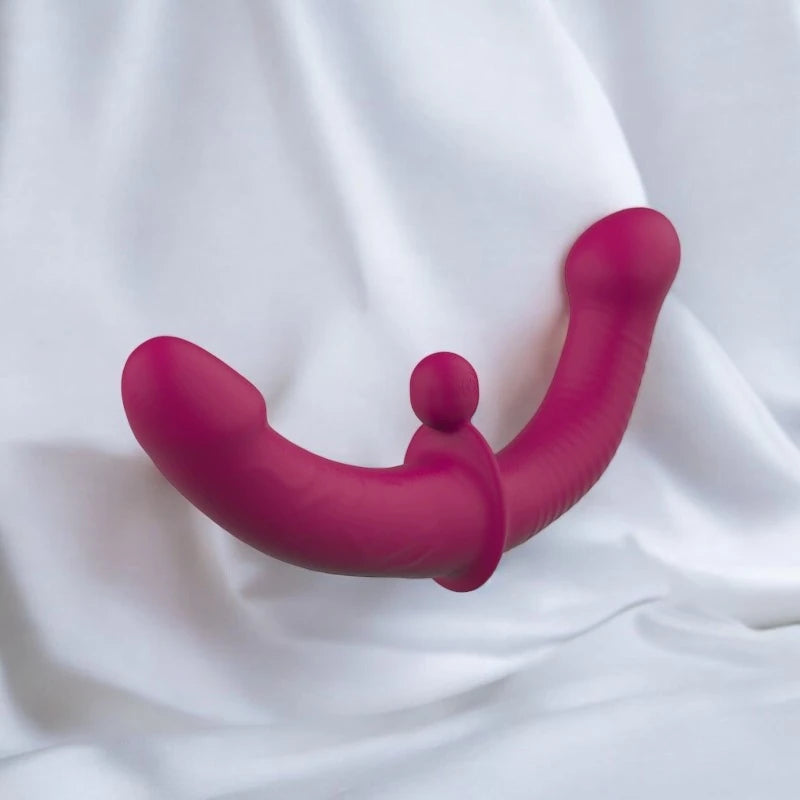 A purple double ended dildo with a remote control.